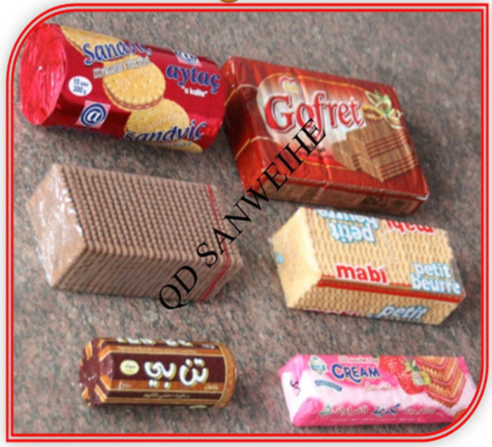 Macchina automatica per il confezionamento di torte di riso/biscotti/cialde con incarto avvolgente